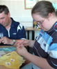 Allison and Andrew make textile books at Newton Aycliffe